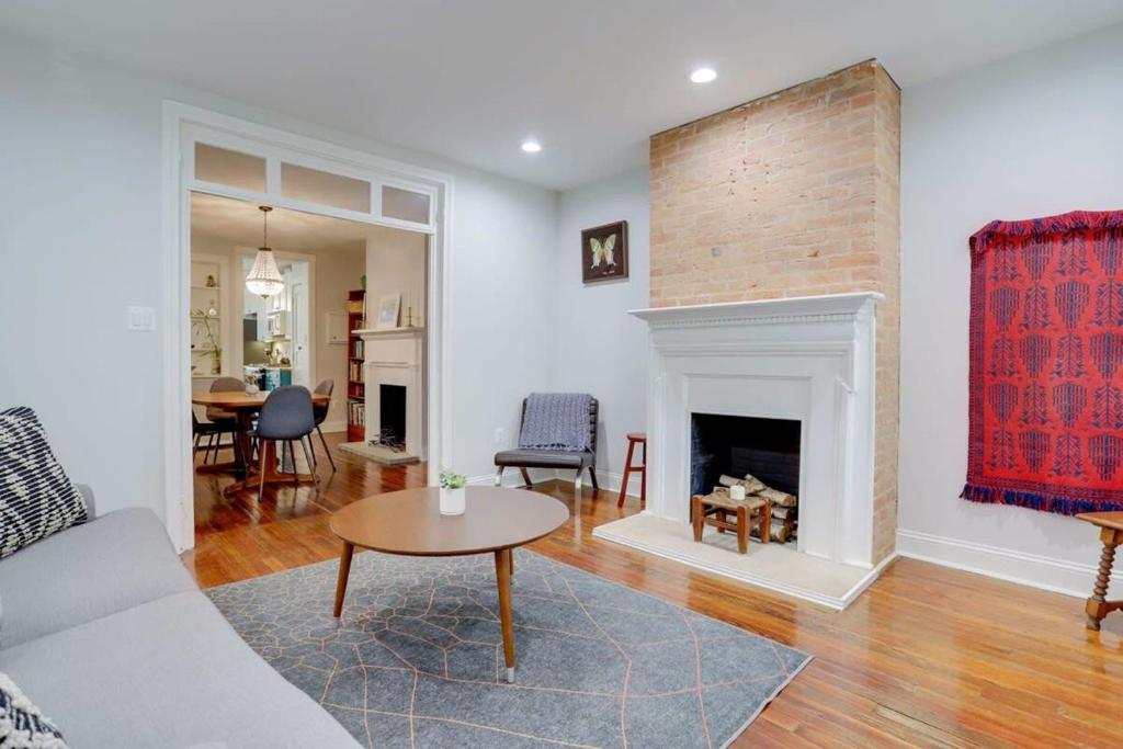 a living room with a couch and a fireplace at Sojourn Historic Location 2 BR 2 BA in Washington