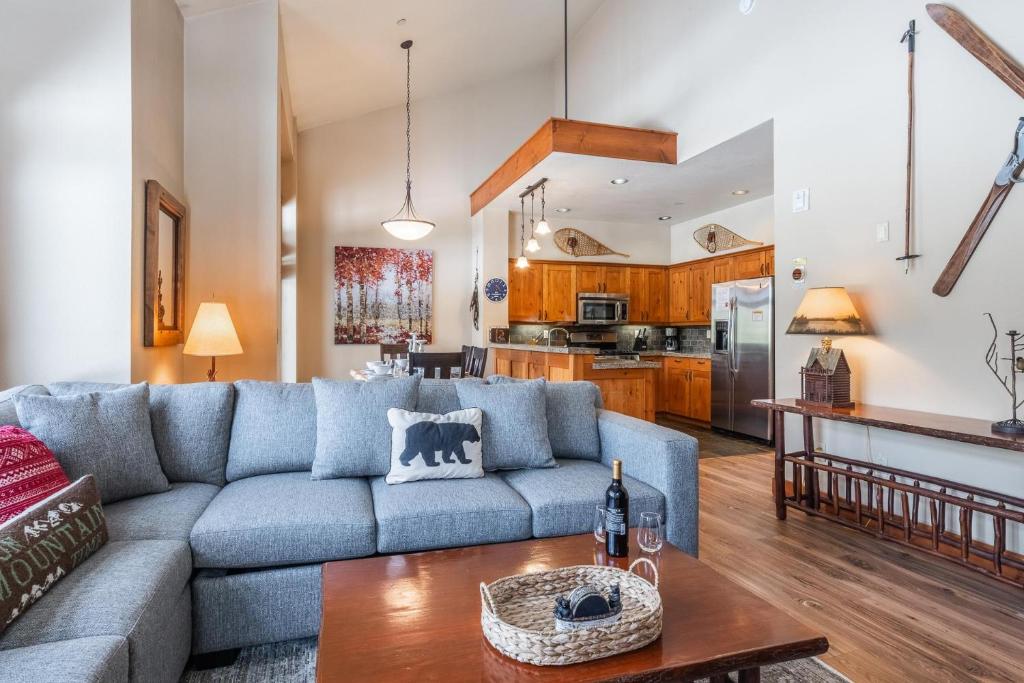 a living room with a couch and a table at Cabins 24 in Mammoth Lakes