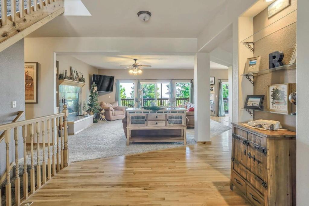 a large living room with a staircase and a living room at Nature's Oasis 4BD Ranch Retreat Hot tub in Peyton