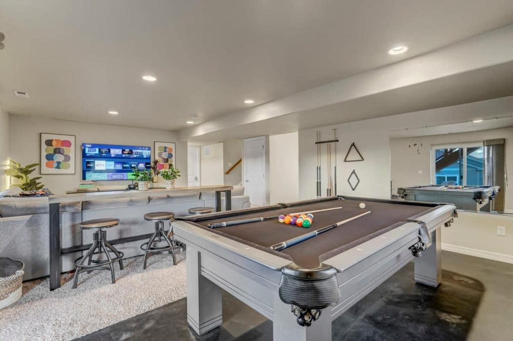 a large room with a pool table and a bar at Room to Spread Out & Deck with Mountain Views in Monument