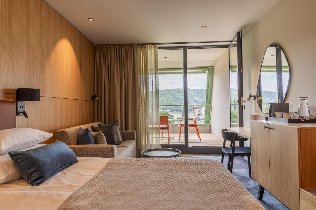 Postel nebo postele na pokoji v ubytování Hotel Svoboda - Terme Krka