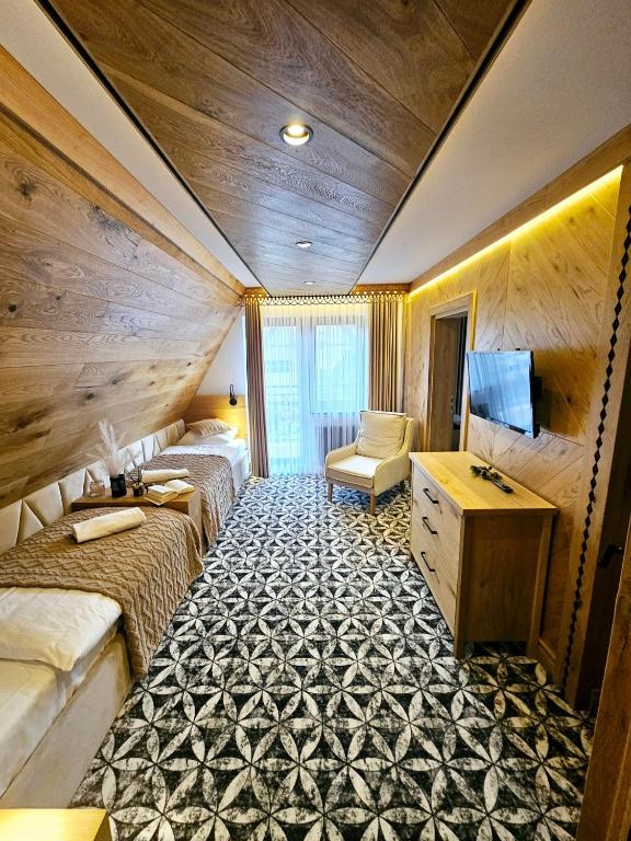 Televízia a/alebo spoločenská miestnosť v ubytovaní Willa Regina I Resort & SPA