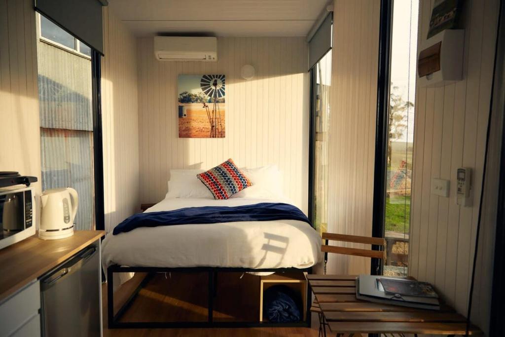 Postel nebo postele na pokoji v ubytování Farm Tiny