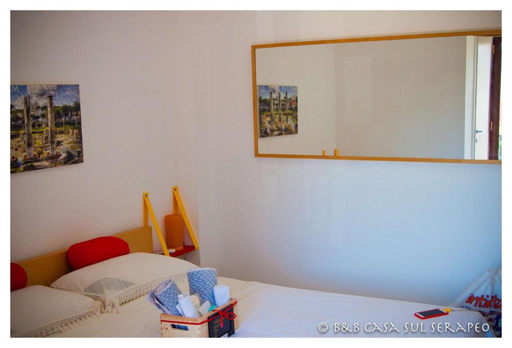 Postel nebo postele na pokoji v ubytování Casa sul Serapeo