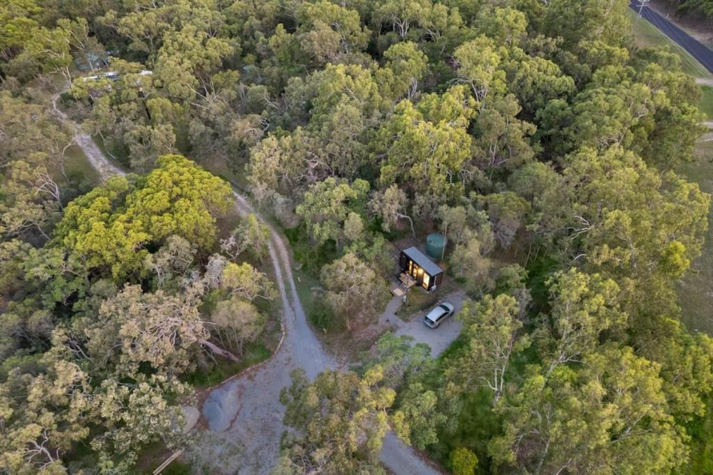 an aerial view of a house in the middle of a forest at Wildlife Haven in Agnes Water