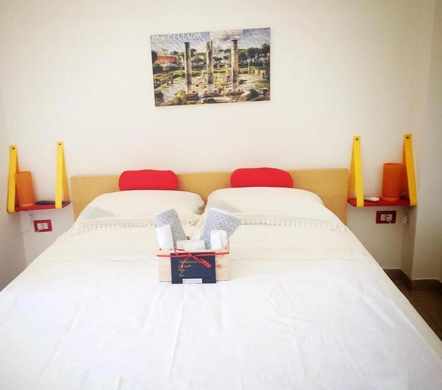 Postel nebo postele na pokoji v ubytování Casa sul Serapeo