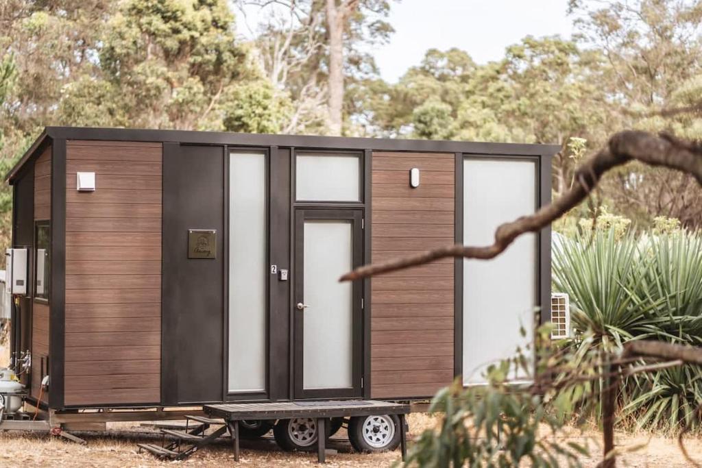 a small black and white tiny house on a trailer at Wally's Retreat 1 in Balingup