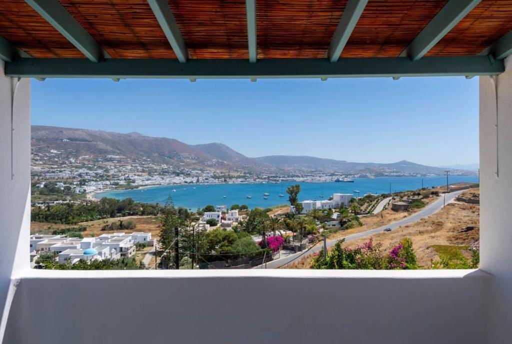 a view of a bay from a window at Parikia Cove Mansion in Parikia