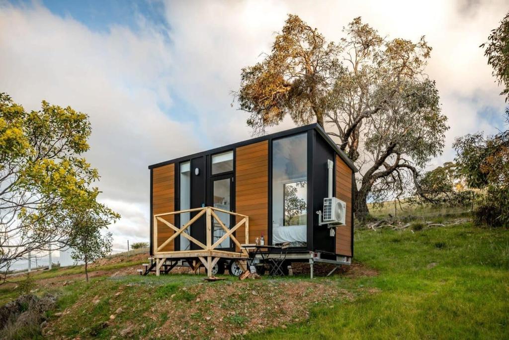 a tiny house sitting on top of a hill at Montara Views 2 in Ararat