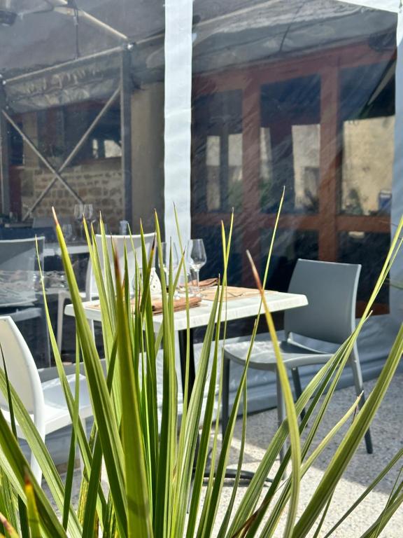 Posezení v ubytování Hôtel Restaurant le clos de l 'Ancien Pressoir