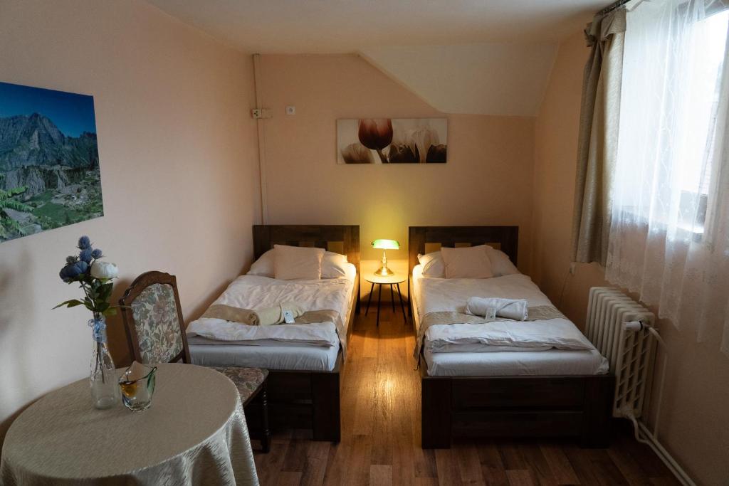 Postel nebo postele na pokoji v ubytování Hotel U Beránků