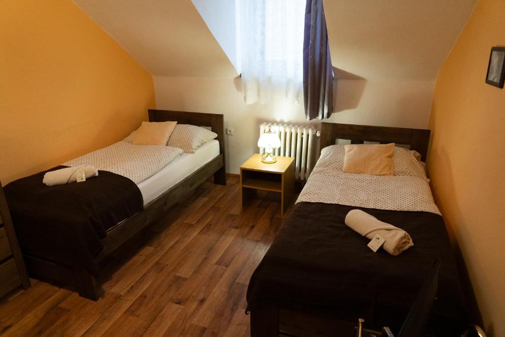 Postel nebo postele na pokoji v ubytování Hotel U Beránků