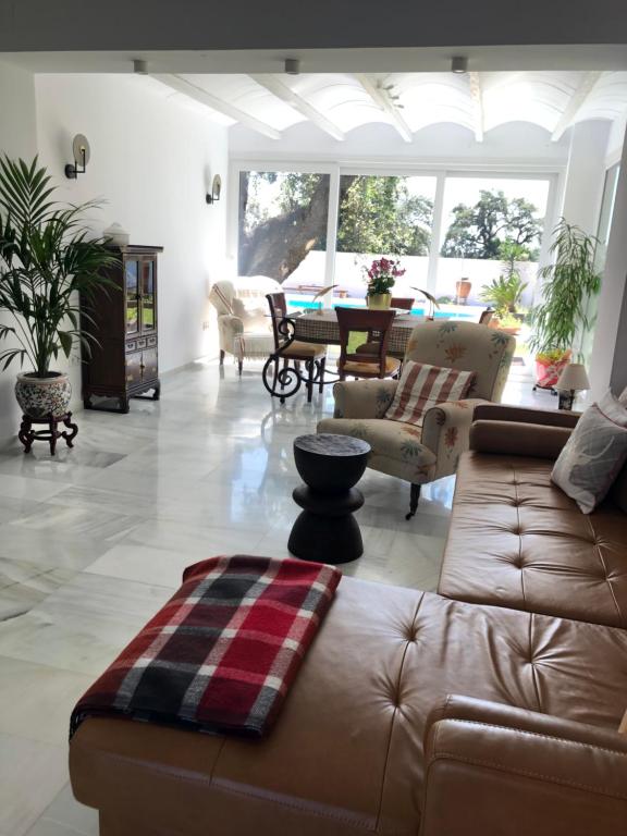 a living room with a couch and a table at Juliana 3 home in Seville