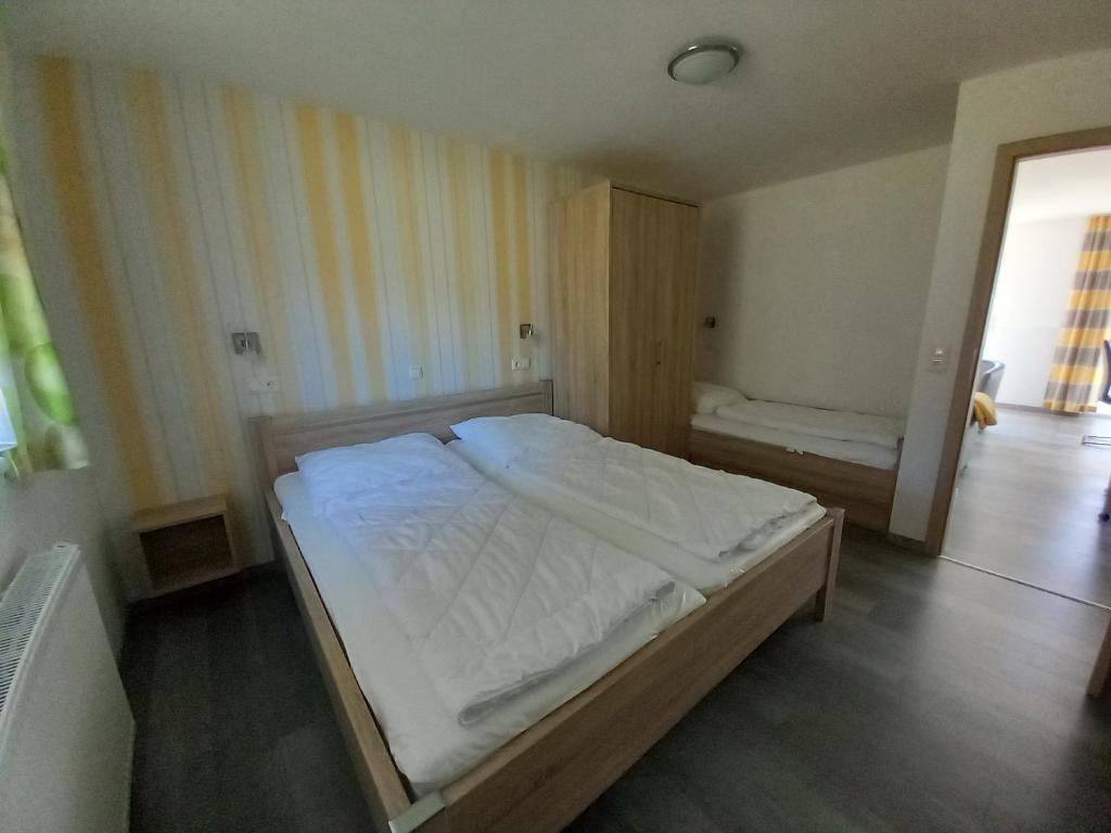Postel nebo postele na pokoji v ubytování Feriencamp Trassenheide