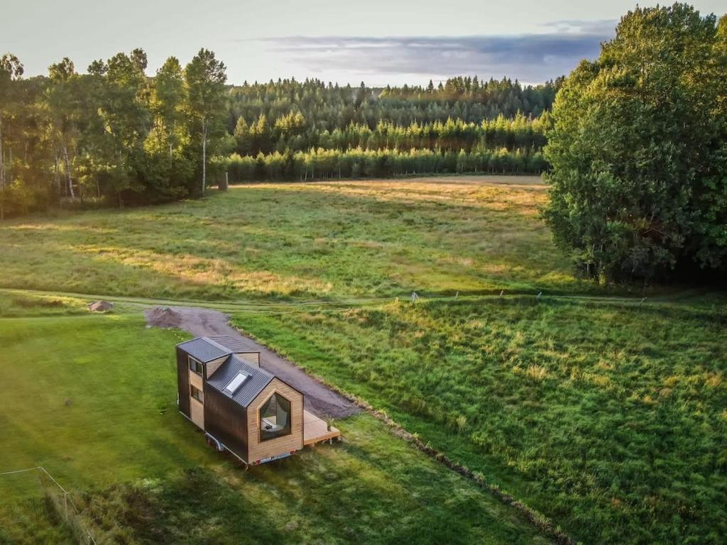 an overhead view of a tiny house in a field at Bostebacken Gard Tiny House in Eckerud