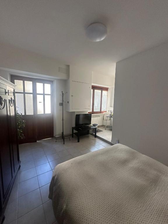 Postel nebo postele na pokoji v ubytování Giuditta Room
