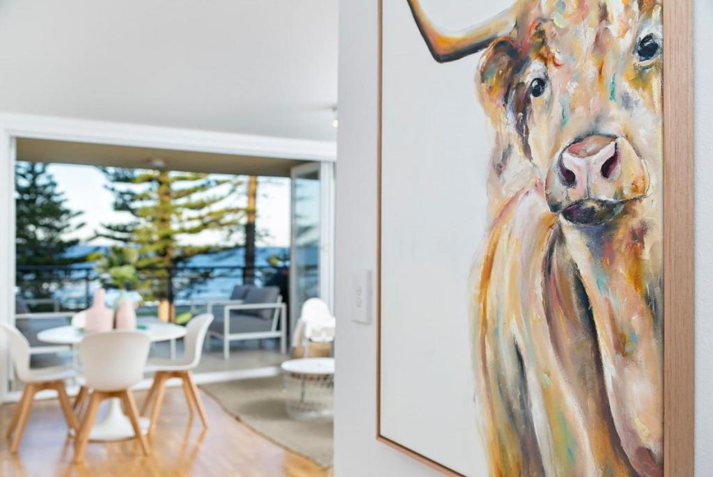 a painting of a horse head on a wall at Beachfront Magic Unbeatable Location in Sydney