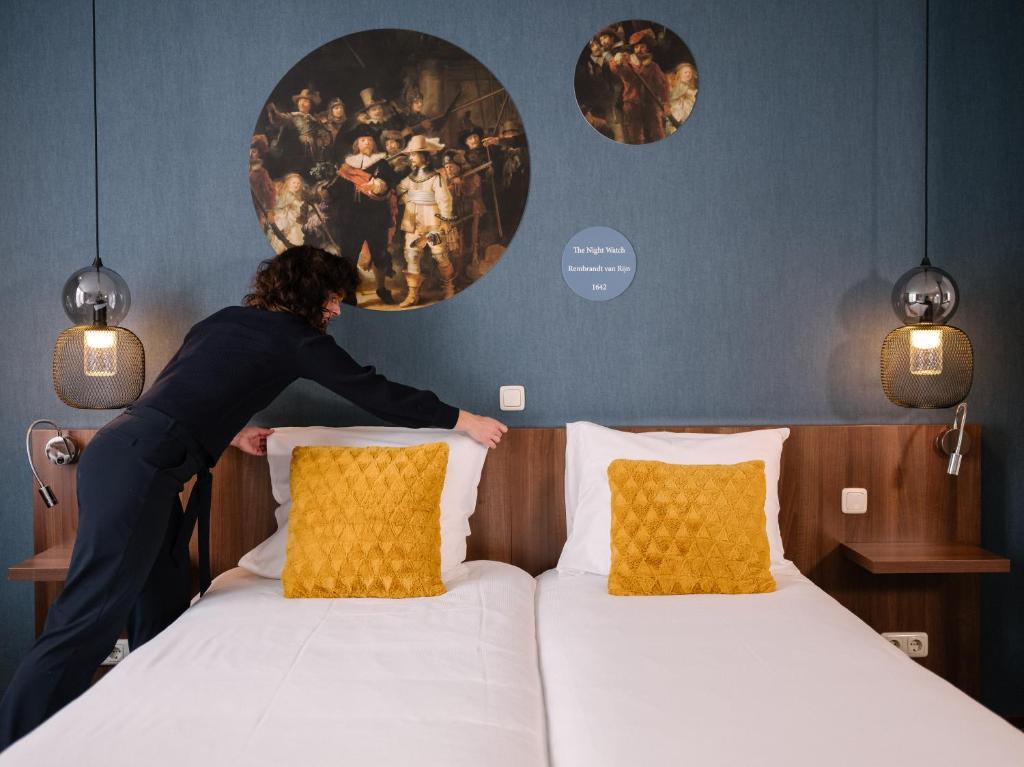 Postel nebo postele na pokoji v ubytování Hotel de Koophandel