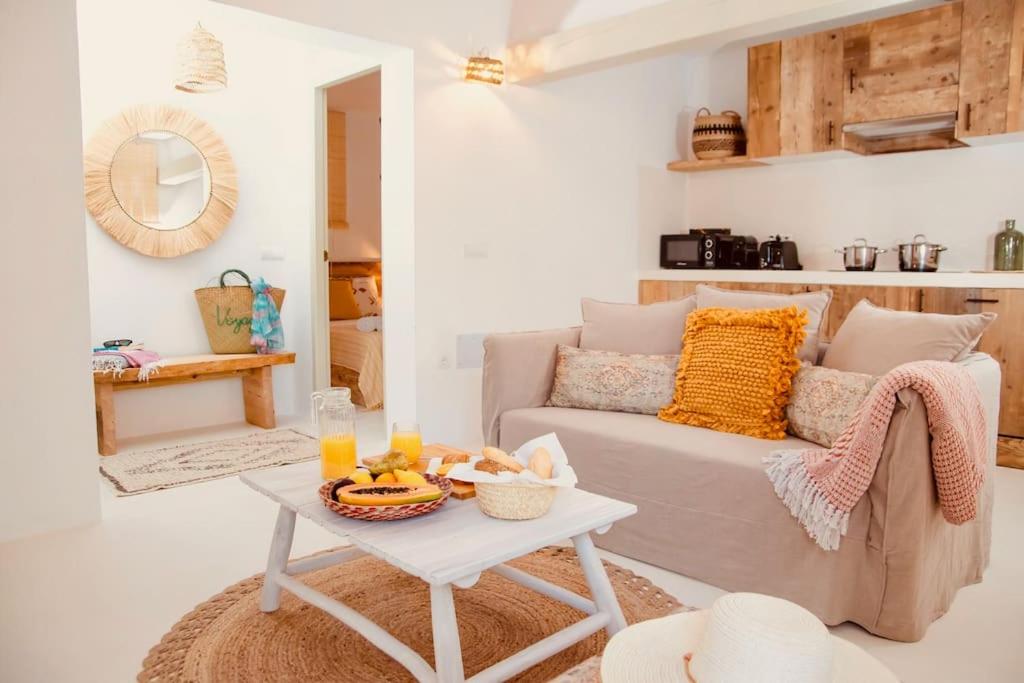 a living room with a couch and a table at Can Roca - Modern & Stylish Villa in Sant Ferran de Ses Roques