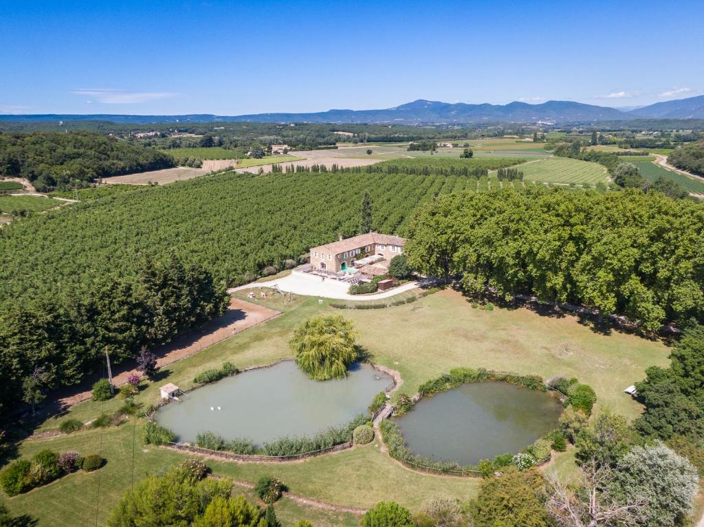 an aerial view of an estate with two ponds at Mas Loisonville - Demeure d'exception & Spa en Drôme Provençale in Grillon