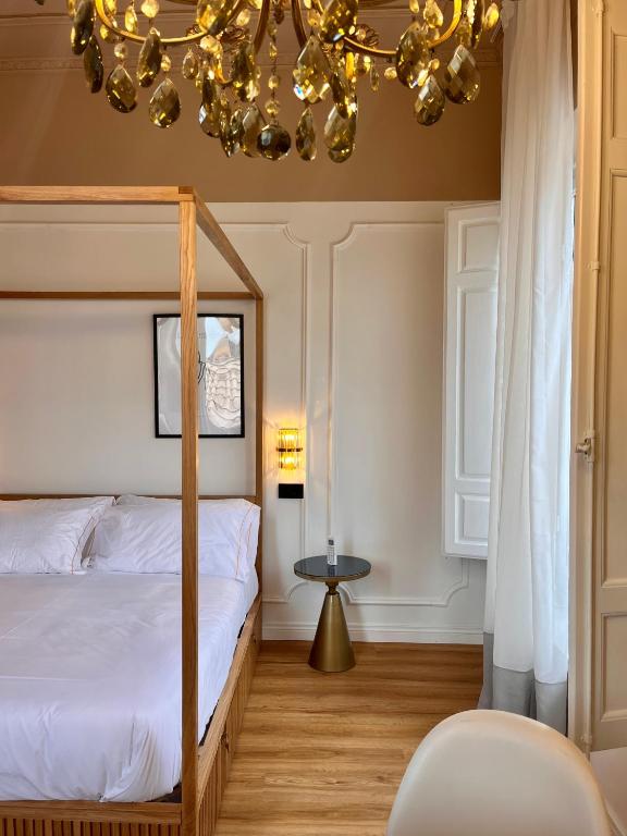 Postel nebo postele na pokoji v ubytování Clemente Rooms