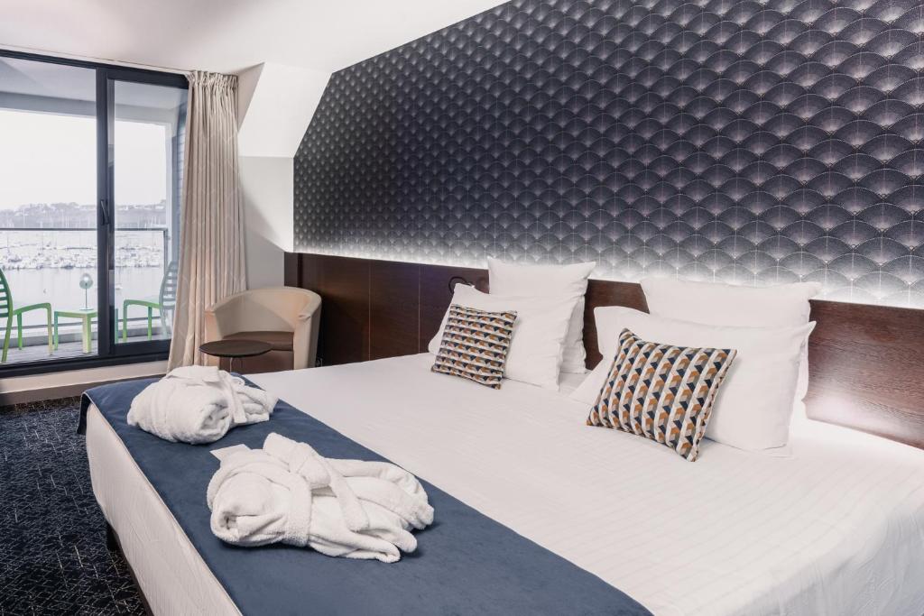 Postel nebo postele na pokoji v ubytování Le Thalassa Hôtel & Spa