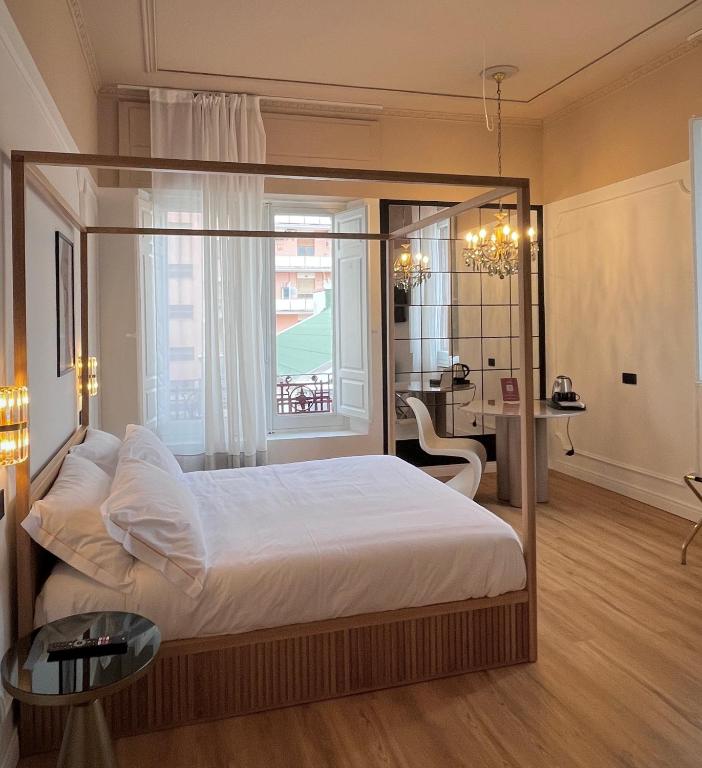 Postel nebo postele na pokoji v ubytování Clemente Rooms