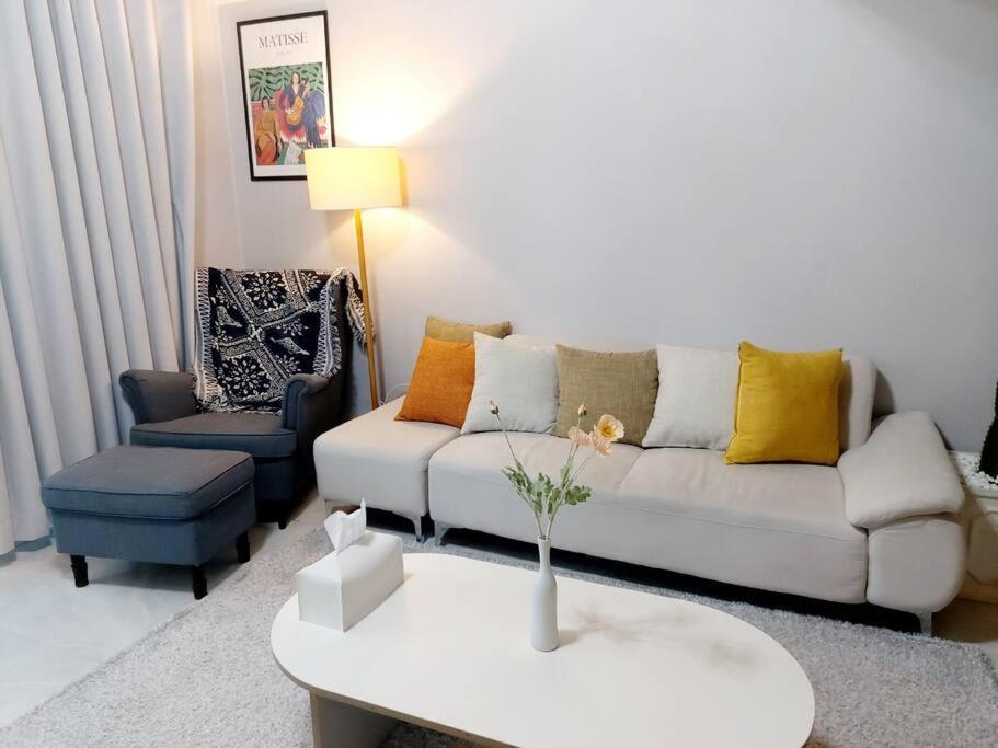 a living room with a couch and a chair at Jin House Incheon Geomamstation in Incheon
