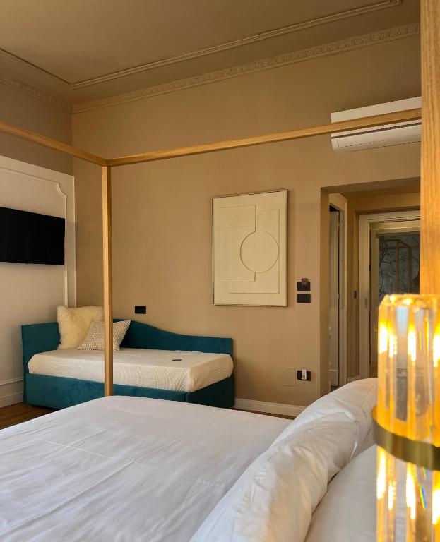 Postel nebo postele na pokoji v ubytování Clemente Rooms