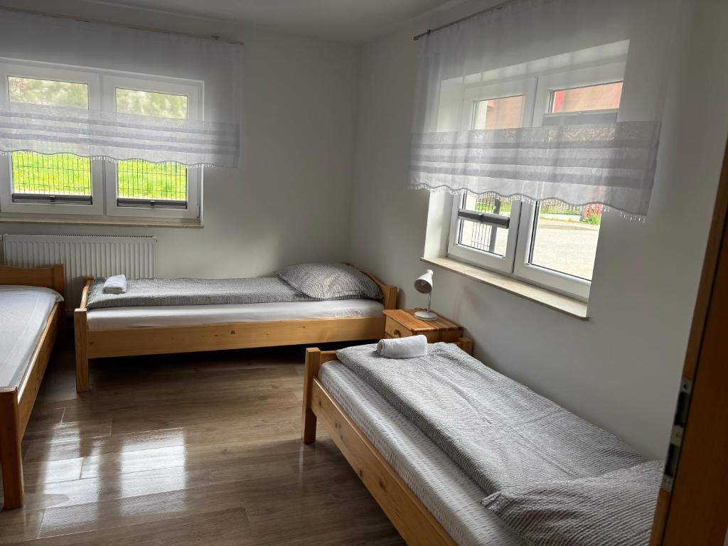 Postel nebo postele na pokoji v ubytování Domek nad Dunajcem