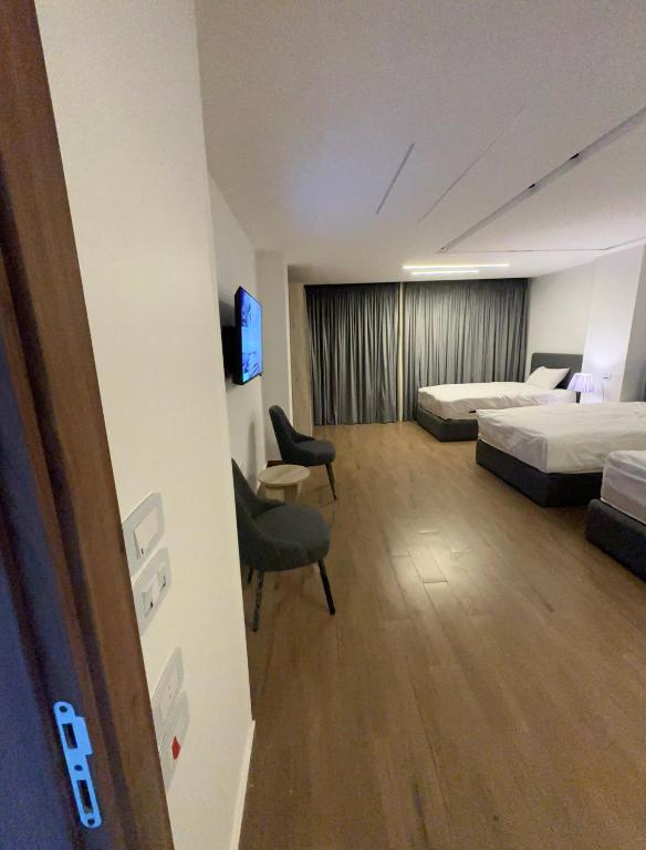 Postel nebo postele na pokoji v ubytování بنسيون الحصري اكتوبر modern motel