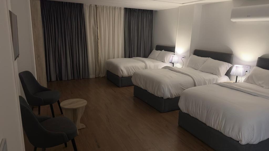 Postel nebo postele na pokoji v ubytování بنسيون الحصري اكتوبر modern motel