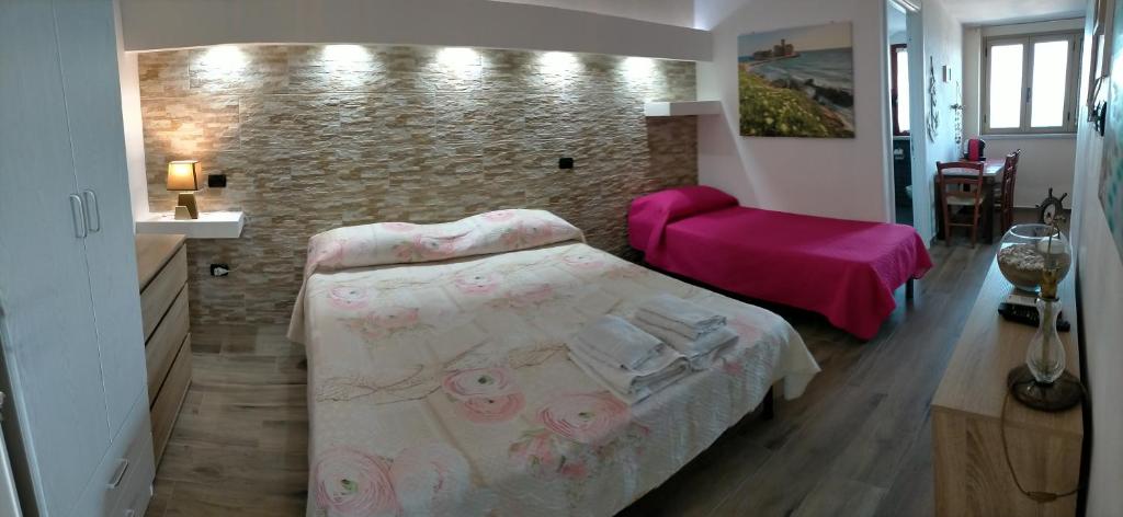 Postel nebo postele na pokoji v ubytování Re Mare B&B