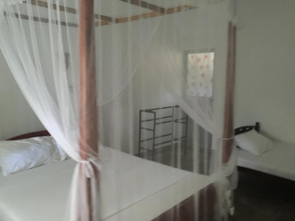 Postel nebo postele na pokoji v ubytování Unawatuna Backpacker Lodge