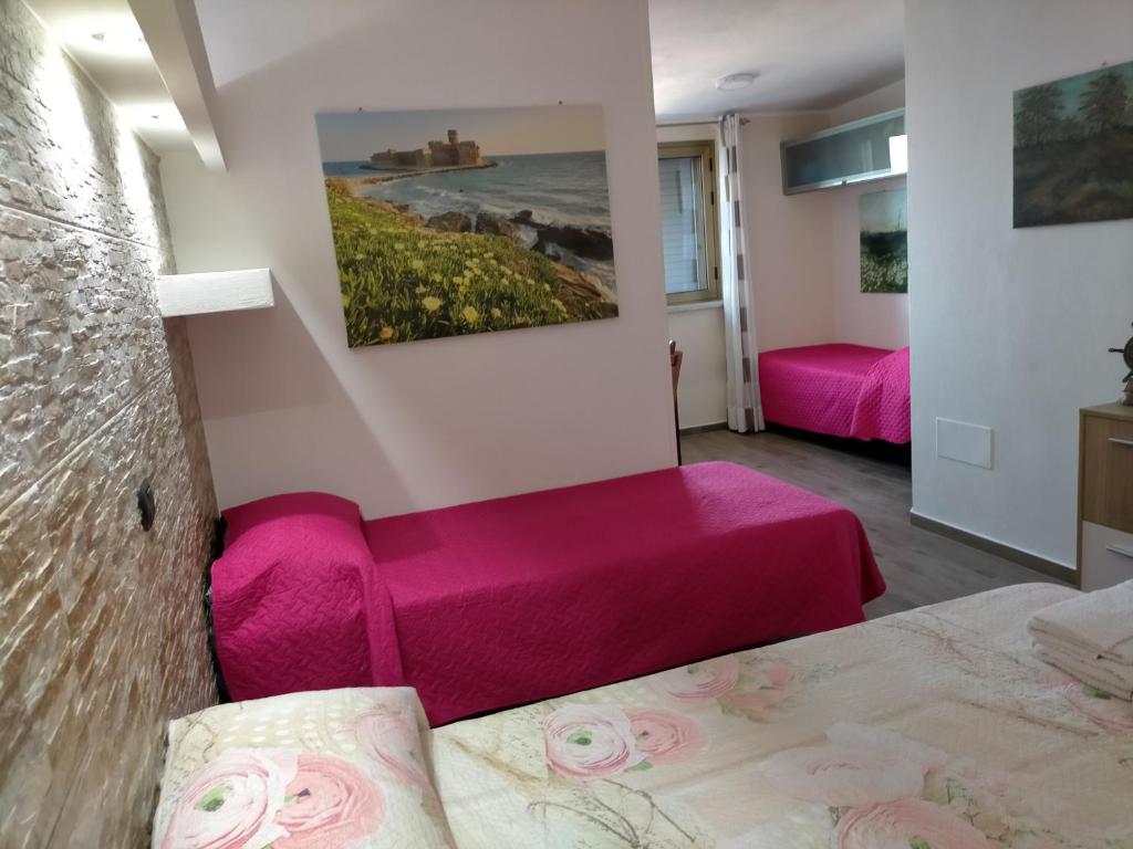 Postel nebo postele na pokoji v ubytování Re Mare B&B