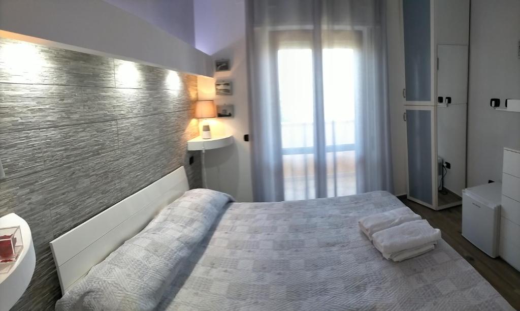Postel nebo postele na pokoji v ubytování Re Mare B&B