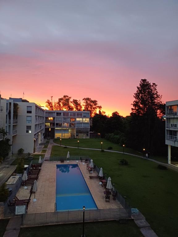 a view of a courtyard with a pool and a building at FerPilar Suite, Concord Pilar in Pilar