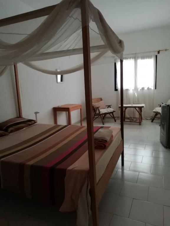 Voodi või voodid majutusasutuse Maison Manour Chambre espacée et climatisée toas
