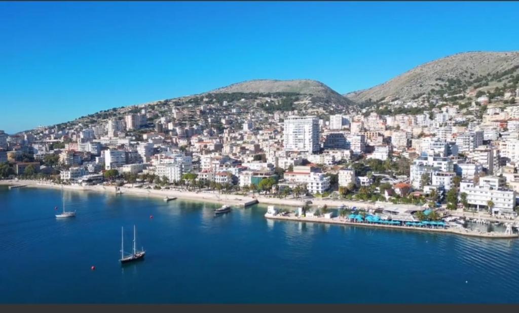 an aerial view of a city with boats in the water at Apartment in Sarandë