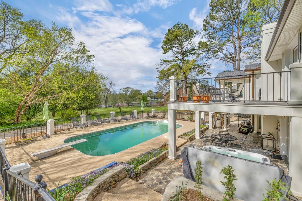 a house with a swimming pool and a balcony at The Lakehouse in Hendersonville