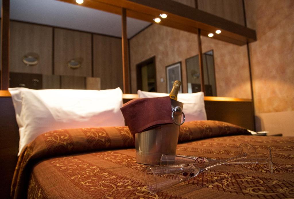 Postel nebo postele na pokoji v ubytování Hotel Motel Ovest