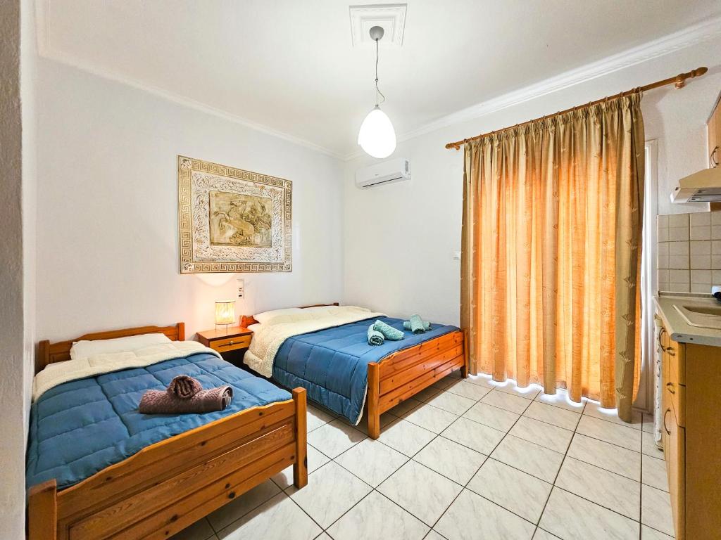 Postel nebo postele na pokoji v ubytování Hotel Exarhos