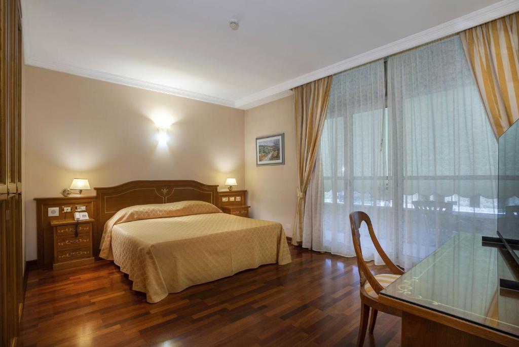 Postel nebo postele na pokoji v ubytování Hotel Firenze
