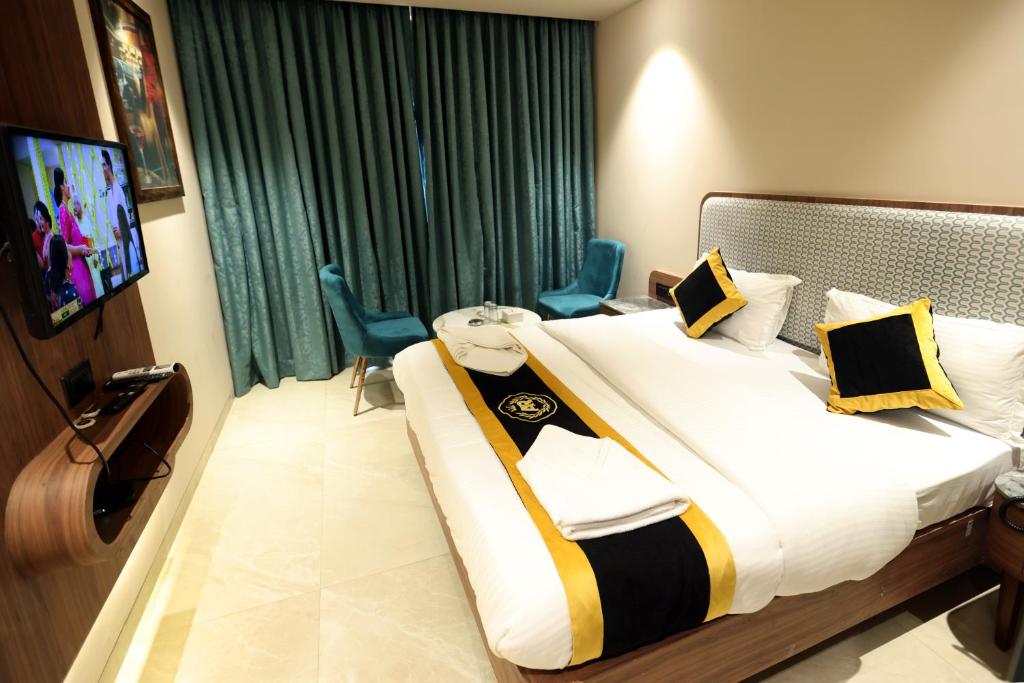 Postel nebo postele na pokoji v ubytování Hotel A R Paradise
