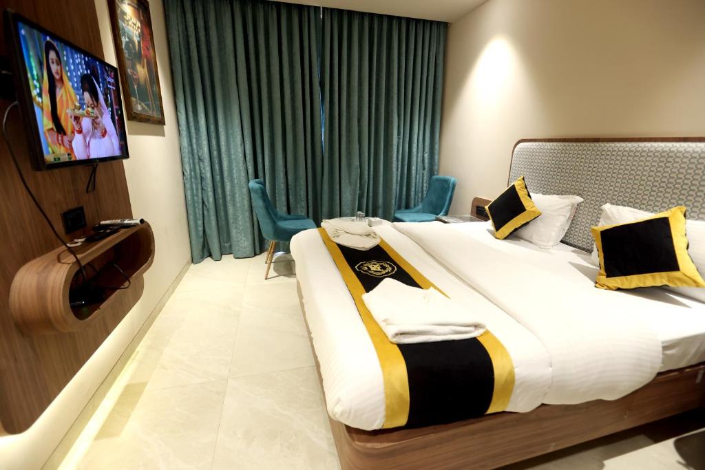 Postel nebo postele na pokoji v ubytování Hotel A R Paradise