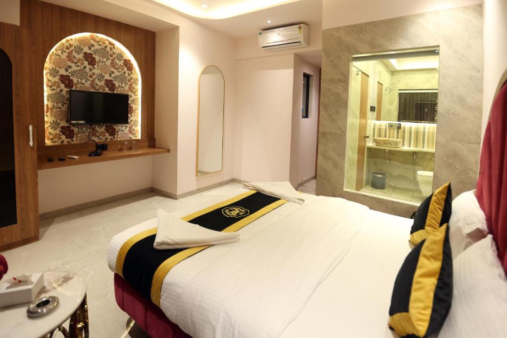 Postel nebo postele na pokoji v ubytování Hotel A R Paradise