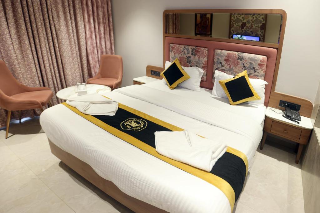 Postel nebo postele na pokoji v ubytování Hotel A R Paradise