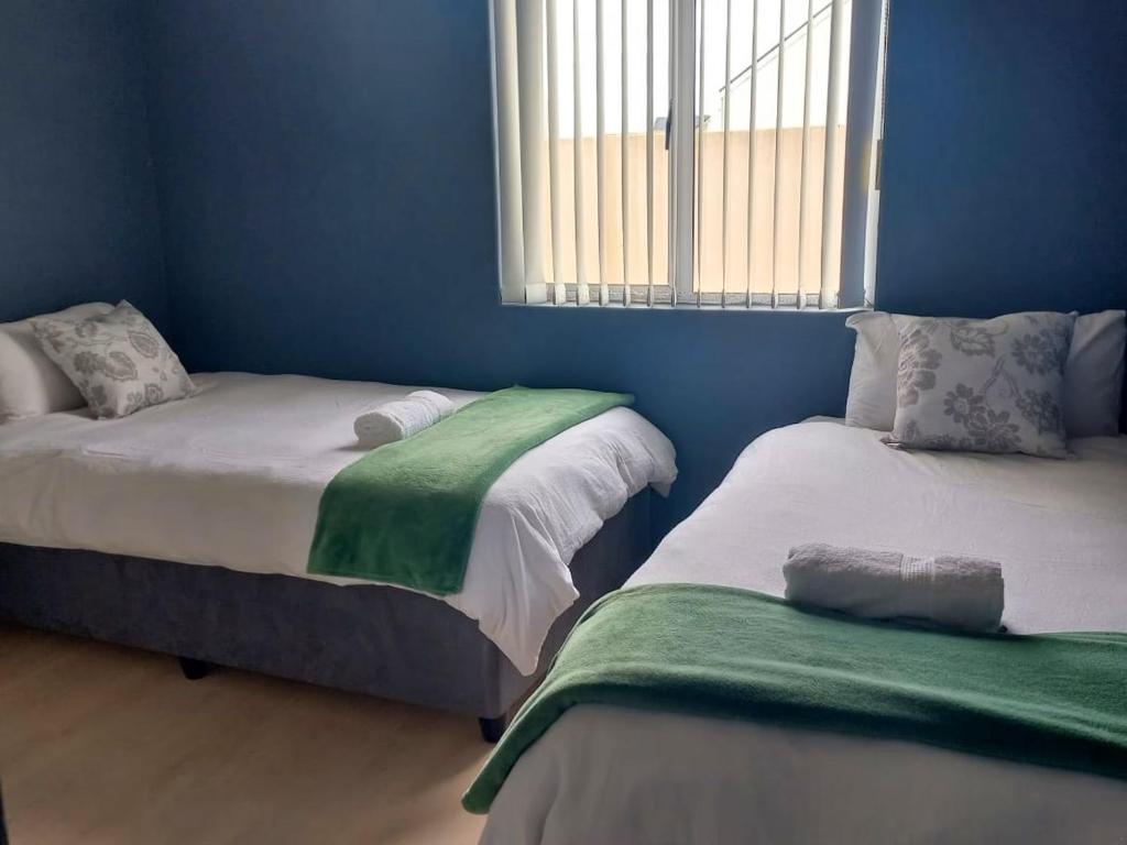 Giường trong phòng chung tại SPERANZA