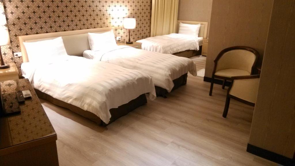 Postel nebo postele na pokoji v ubytování A casa Hotel