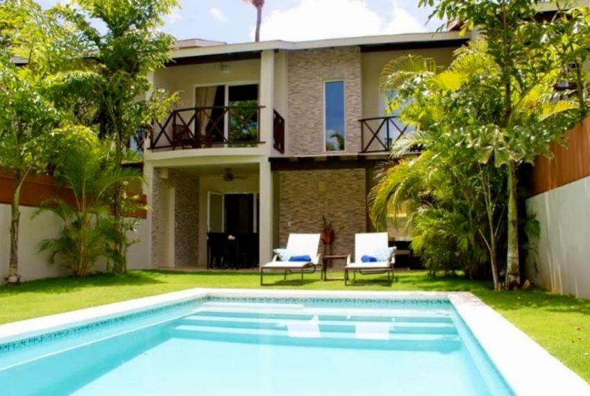a house with a swimming pool in front of a house at Escalonia 2 in Las Terrenas